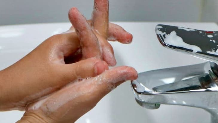Washing hands at the sink