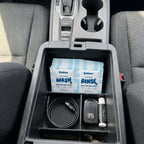 Bubbez twin sachet sitting in a vehicle center console