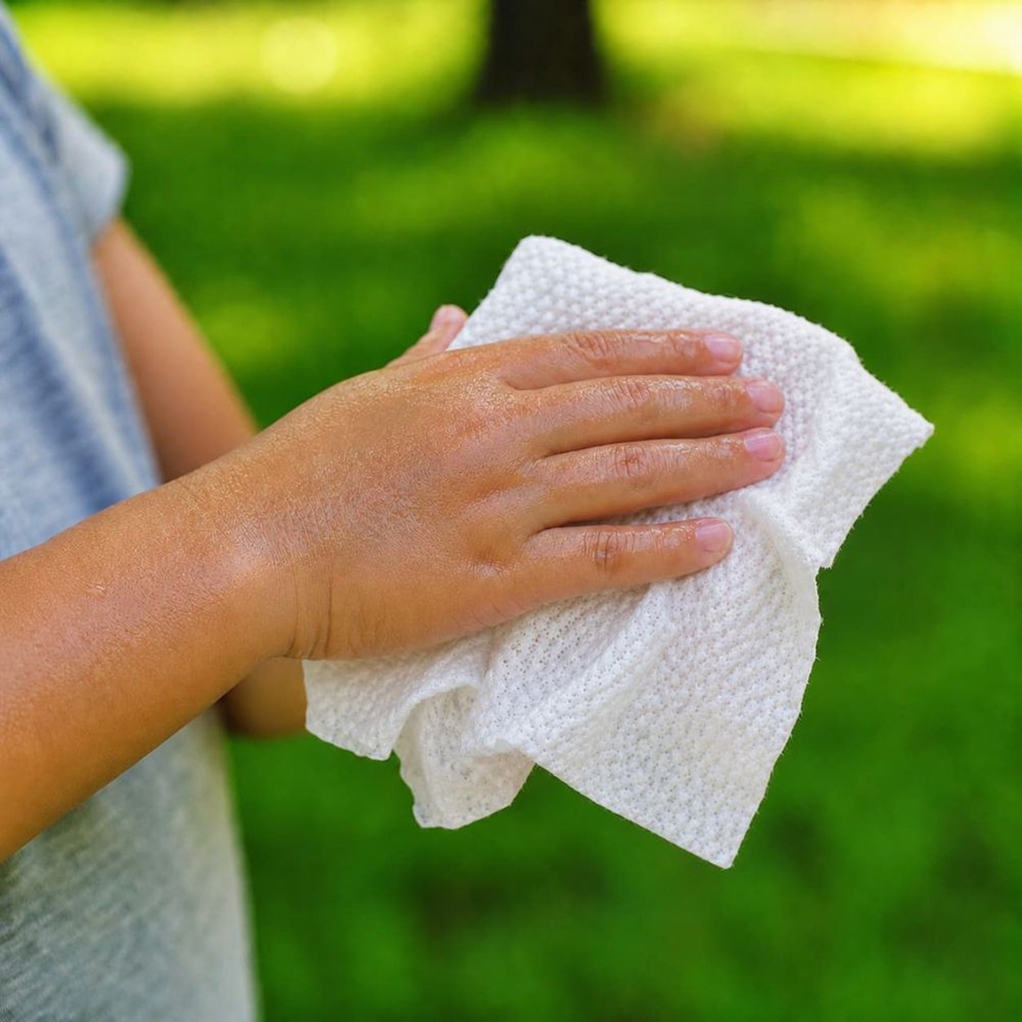 Step 2 close-up of Bubbez clean water RINSE wipe in use on hands
