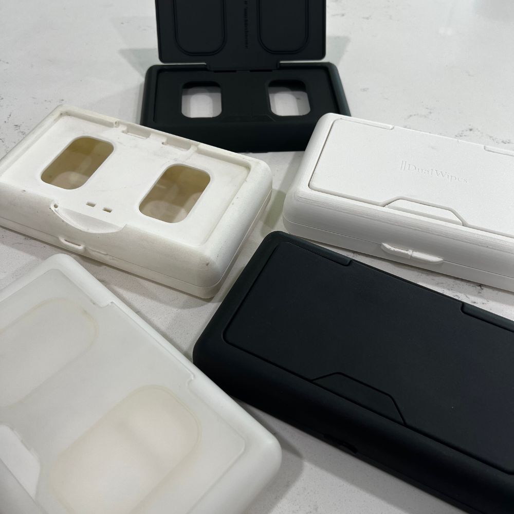 Collection of phone cases in various colors on a light surface